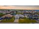 Stunning waterfront home featuring lush landscaping, a private dock, and panoramic views of the surrounding community at 5265 Neville Ter, Port Charlotte, FL 33981
