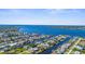Expansive aerial view of a waterfront community showcasing beautiful homes with access to the tranquil river at 5265 Neville Ter, Port Charlotte, FL 33981