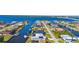 Aerial view showcases beautiful waterfront homes lining the canals, some with solar panels and boat lifts at 5265 Neville Ter, Port Charlotte, FL 33981