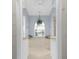 Bathroom with soaking tub, walk-in closet, neutral colors and decorative plant at 5265 Neville Ter, Port Charlotte, FL 33981