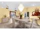 Bright dining room featuring a modern chandelier and neutral decor at 5265 Neville Ter, Port Charlotte, FL 33981