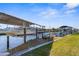 Private boat dock featuring a boat lift and direct access to the open water at 5265 Neville Ter, Port Charlotte, FL 33981