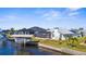 Beautiful waterfront home with boat lift, screened-in lanai, and lush landscaping at 5265 Neville Ter, Port Charlotte, FL 33981