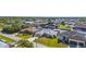 Exterior aerial view of waterfront homes showcasing well-maintained lawns, boat docks, and canal access at 5265 Neville Ter, Port Charlotte, FL 33981