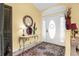 Inviting foyer with tile flooring, elegant decor, and ample natural light at 5265 Neville Ter, Port Charlotte, FL 33981