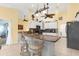 Modern kitchen featuring white cabinetry, granite counters, and stainless steel appliances at 5265 Neville Ter, Port Charlotte, FL 33981