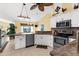 Well-equipped kitchen featuring granite countertops, stainless appliances, and modern cabinets at 5265 Neville Ter, Port Charlotte, FL 33981