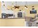 Kitchen with granite countertops, stainless steel appliances, and bright yellow walls at 5265 Neville Ter, Port Charlotte, FL 33981