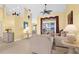 Bright and airy living room featuring tile floors, comfortable seating, and access to the outdoors at 5265 Neville Ter, Port Charlotte, FL 33981