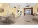 Bright living room featuring tile floors, high ceilings, and access to the outdoor patio at 5265 Neville Ter, Port Charlotte, FL 33981