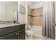 Well-appointed bathroom with granite countertops, tiled shower, and modern fixtures at 5585 Semolino St, Nokomis, FL 34275