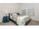 Cozy bedroom with neutral tones, a comfortable bed, and natural light from the windows at 5585 Semolino St, Nokomis, FL 34275