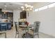 Dining area with modern chandelier and access to kitchen at 5585 Semolino St, Nokomis, FL 34275
