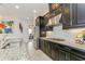 Kitchen includes stainless steel appliances, granite countertops and a subway tile backsplash at 5585 Semolino St, Nokomis, FL 34275