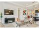 Bright living room features a fireplace, open floor plan, and modern decor at 5585 Semolino St, Nokomis, FL 34275