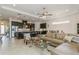 Open concept living room with kitchen and dining area at 5585 Semolino St, Nokomis, FL 34275