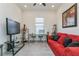 Comfortable office featuring a work space, modern furniture, and neutral decor and lots of natural light at 5585 Semolino St, Nokomis, FL 34275