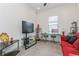 Bright office with work space, modern furniture, neutral decor and lots of natural light at 5585 Semolino St, Nokomis, FL 34275