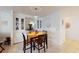 Cozy dining room with seating for four and a built-in china cabinet at 5619 Bayshore Rd # 421, Palmetto, FL 34221