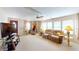 Bright living room with comfortable seating, ample natural light, and a ceiling fan at 5619 Bayshore Rd # 421, Palmetto, FL 34221