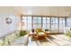 Bright sunroom with large windows, comfortable seating, and charming decorative accents at 5619 Bayshore Rd # 421, Palmetto, FL 34221