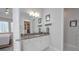 Bathroom featuring a vanity, marble floors, and a closet at 5632 Long Shore Loop, Sarasota, FL 34238