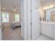 View from the bedroom to the bathroom, a harmonious transition between spaces at 5632 Long Shore Loop, Sarasota, FL 34238