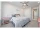 Comfortable bedroom with a ceiling fan, soft carpet, closet, and soothing décor at 5632 Long Shore Loop, Sarasota, FL 34238