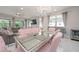 Open dining area features modern decor with large windows and natural light, perfect for entertaining at 5632 Long Shore Loop, Sarasota, FL 34238