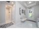 Bright foyer featuring a bench, and white marble floors at 5632 Long Shore Loop, Sarasota, FL 34238