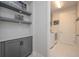 Functional laundry room with cabinets and counter space at 5632 Long Shore Loop, Sarasota, FL 34238