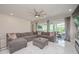Comfortable living room features recessed lighting, ceiling fan, and marble flooring at 5632 Long Shore Loop, Sarasota, FL 34238