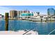 Waterfront view of a marina filled with boats, showcasing the building at 5632 Long Shore Loop, Sarasota, FL 34238