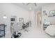 Bright office featuring a salon chair and a view to an adjacent room at 5632 Long Shore Loop, Sarasota, FL 34238