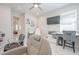 Bright office featuring a salon chair, television, and a view to an adjacent room at 5632 Long Shore Loop, Sarasota, FL 34238