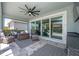 Outdoor living featuring a ceiling fan, wicker furniture and a view of the pool at 5632 Long Shore Loop, Sarasota, FL 34238