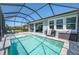A beautiful screened-in pool with a covered patio and plenty of space for entertaining at 5632 Long Shore Loop, Sarasota, FL 34238