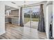 View from the kitchen area to the outdoor backyard and patio, through large sliding glass doors at 5755 Oxalis Rd, Venice, FL 34293