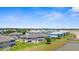 Exterior view highlighting well-maintained condo buildings with picturesque water views and lush greenery at 5800 Sabal Trace Dr # 101, North Port, FL 34287