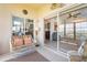 Inviting lanai featuring comfortable seating and a seamless transition to the interior via sliding glass doors at 5800 Sabal Trace Dr # 101, North Port, FL 34287