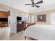 Spacious main bedroom with tiled floors, a large bed, a dresser, and sliding doors to the outdoors at 5800 Sabal Trace Dr # 101, North Port, FL 34287