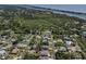 Aerial view of a neighborhood with houses near a river and a recreation trail at 5931 Plover Rd, Venice, FL 34293
