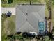 Aerial view of a home featuring a screened-in pool, patio, and well-maintained roof at 5931 Plover Rd, Venice, FL 34293