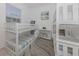 Bright bedroom featuring bunk beds with beach themed decor and a colorful accent rug at 5931 Plover Rd, Venice, FL 34293