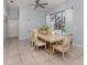 Light, airy dining room with seating for six and a view of the pool at 5931 Plover Rd, Venice, FL 34293