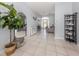 Inviting entryway showcasing tile flooring and view into comfortable living space at 5931 Plover Rd, Venice, FL 34293