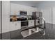 Well-equipped kitchen featuring modern appliances, granite countertops, and sleek design elements at 5931 Plover Rd, Venice, FL 34293