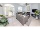 Comfortable living room with a fireplace and plenty of natural light at 5931 Plover Rd, Venice, FL 34293