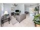 Open concept living room with view to outdoor pool area at 5931 Plover Rd, Venice, FL 34293