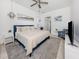Well-lit main bedroom with cool tones and decorative wall art at 5931 Plover Rd, Venice, FL 34293